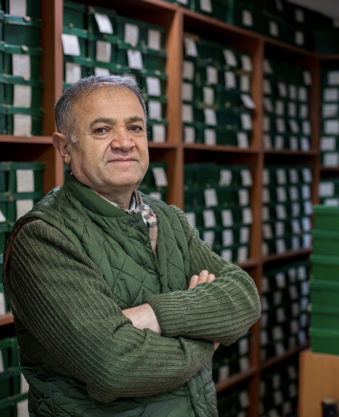 Small business owner in an organized stockroom